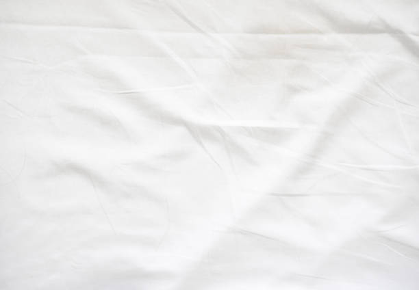 Wrinkle on white bed sheet Wrinkle on white bed sheet. Old white bed sheet. bed sheets stock pictures, royalty-free photos & images