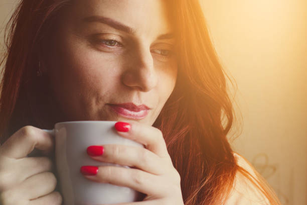 istock Young woman enjoying morning coffee 1084576372