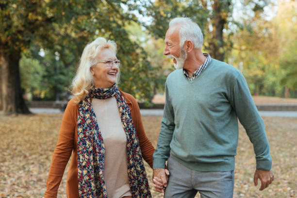 istock Senior couple taking a walk in the park 1084580400