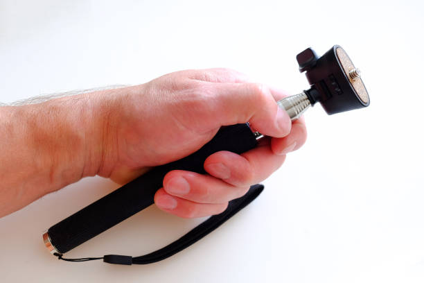 istock Telescopic monopod for photography. Silver with black rubber handle. 1084580882