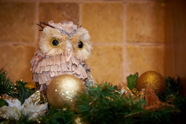 istock Ornamental owl among Christmas decorations. 1084582570