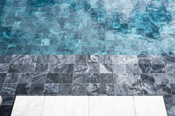 istock part of swimming pool with blue water 1084593704