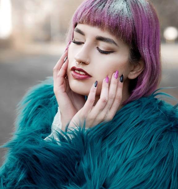 istock Young woman wearing fur coat 1084602534