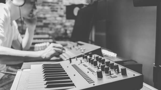 istock asian male composer making music in home studio 1084604544