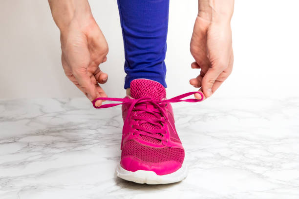 istock Tying shoelaces on sneakers 1084609234