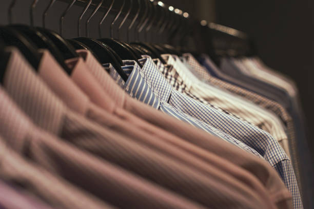 istock Assorted mens dress shirts on hangers 1084609996