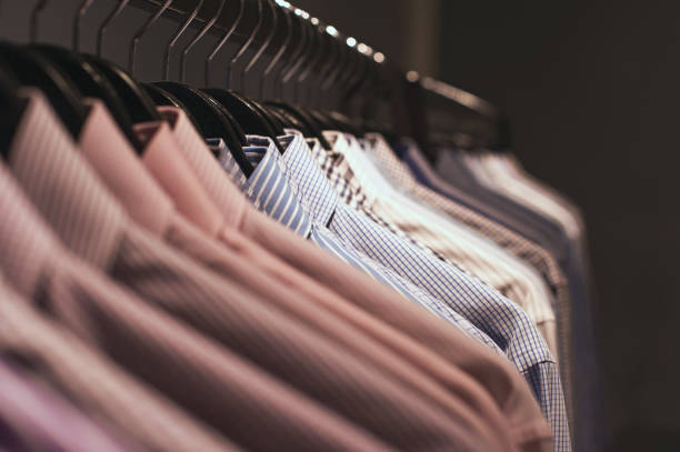 istock Assorted mens dress shirts on hangers 1084611026