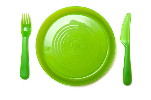 istock set of green baby plastic kitchen ware on white background 1084611824