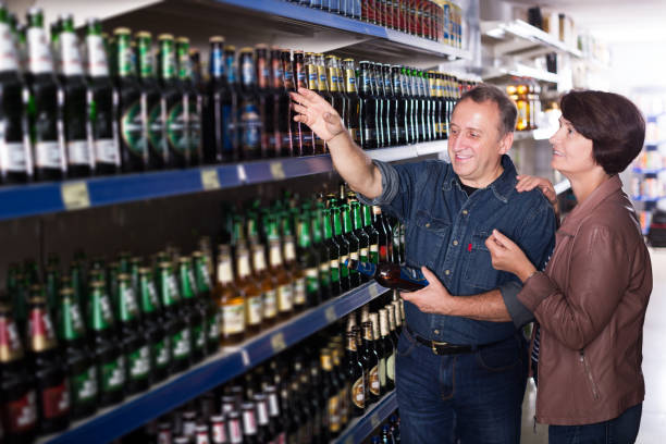 istock Couple shooses beer in store 1084614958