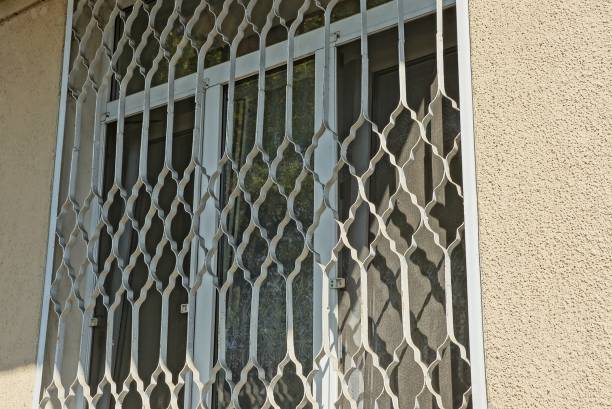 a big one with an iron grille on a brown wall