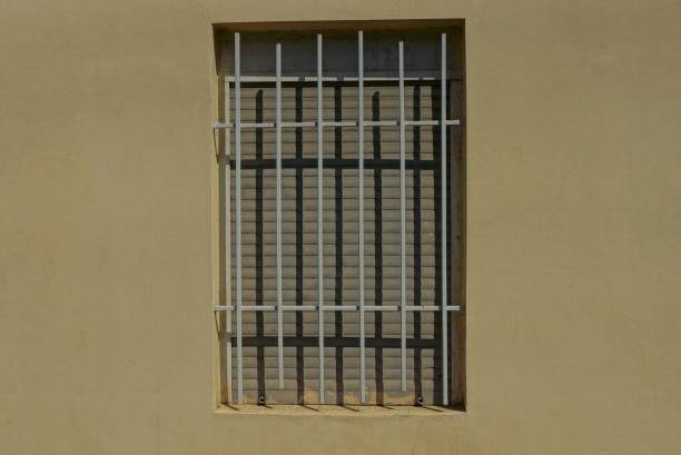 istock one big one with an iron grid on a brown building wall 1084618360