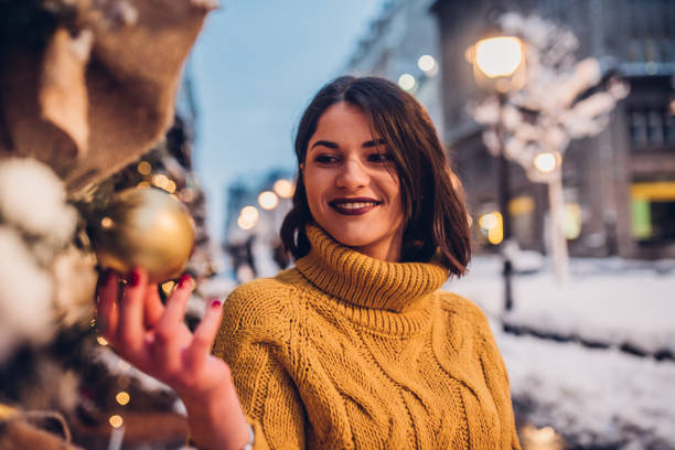 istock Girl looking at Christmas decoration 1084618440