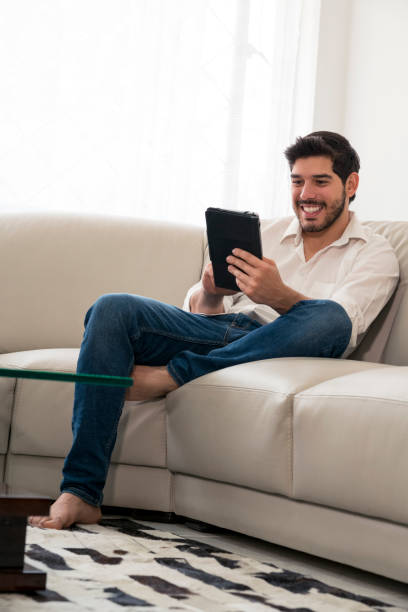 istock Man with the tablet in the room 1084619368