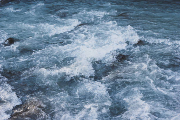 istock Blue flowing water of mountain river 1084620778