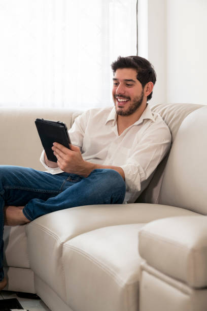 istock Man with the tablet in the room 1084623964