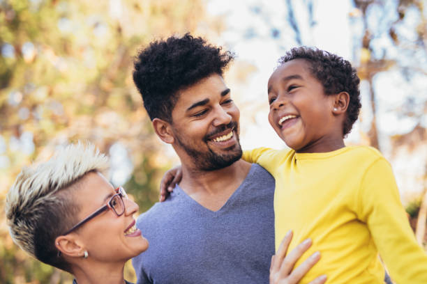 istock Happy young mixed race couple spending time with their daughter 1084624258