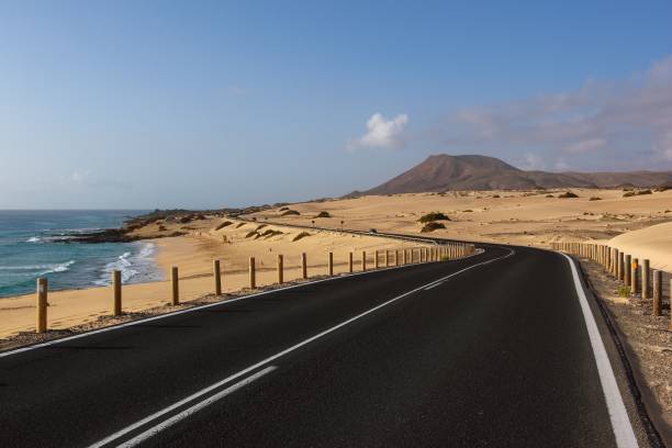 istock Fuerteventura road through sand desert 1084637162