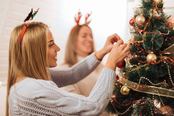 istock Beautiful woman near christmas tree 1084647688