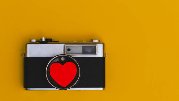 istock Old retro camera on vintage love 1084651348