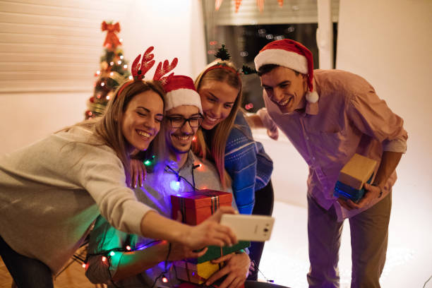 istock Fun during Christmas night with friends at home 1084651508