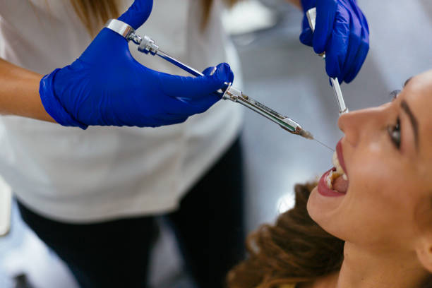 istock Dentist giving anesthesia to the patient 1084657222