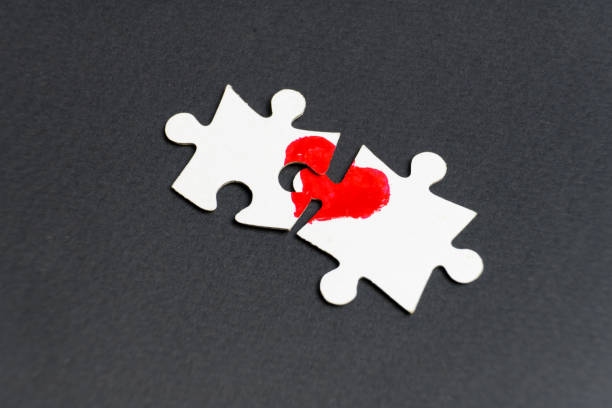 istock Symbol of love. Heart drawn on two puzzles. 1084658940
