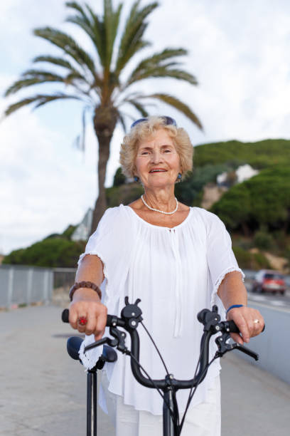 istock Elderly woman going to biking 1084663600
