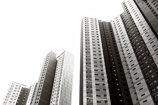 Black and white high rise apartment buildings, white background with copy space, Seoul South Korea, full frame horizontal composition