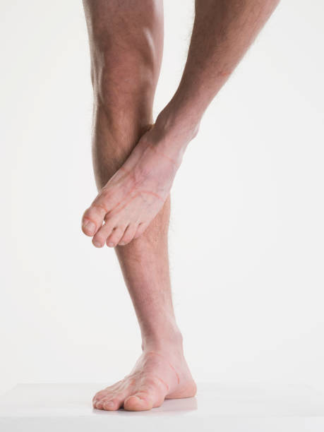 männliche behaarte beine isoliert auf weiss - hairy men sensuality human muscle stock-fotos und bilder