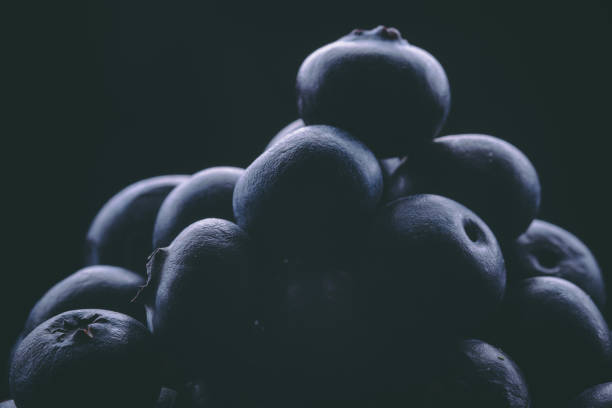 Blueberry blueberries are a healthy food with a green leaf in black or white background