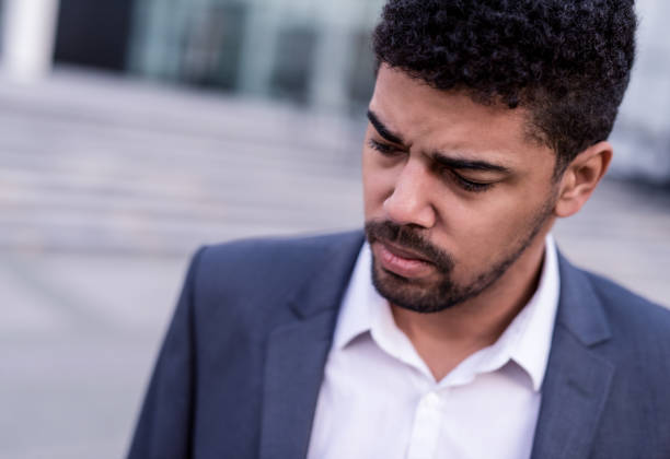istock African American businessman feeling sad. 1084685252