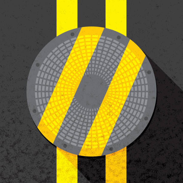Sewer Lid Flat Vector illustration of a sewer lid with yellow stripes against a black background in flat style with a textured effect. sewer lid stock illustrations
