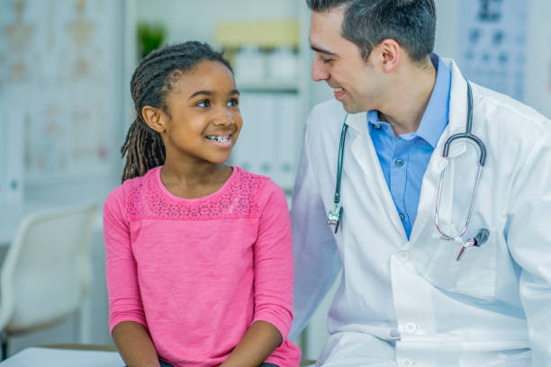 istock Doctor giving a little girl check up 1084688752