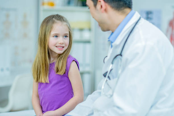 istock Doctor giving a little girl check up 1084688754