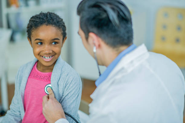 istock Doctor giving a little girl check up 1084688756