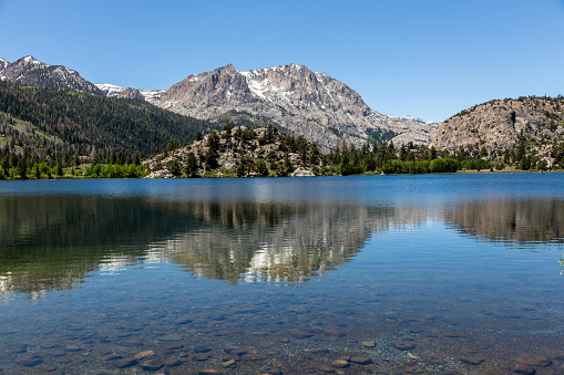 Gull Lake in Mammoth Lakes area USA. Mammoth Lakes is a town in California's Sierra Nevada mountains. It's known for the Mammoth Mountain and June Mountain ski areas and nearby trails.