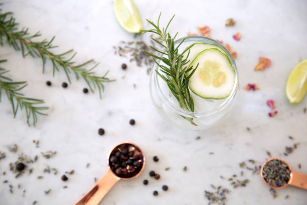 Gin Cocktail with garnish Cocktails on marble table top with spices tonic water stock pictures, royalty-free photos & images
