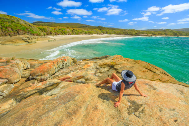 istock Waterfall Beach woman sunbathing 1084702406