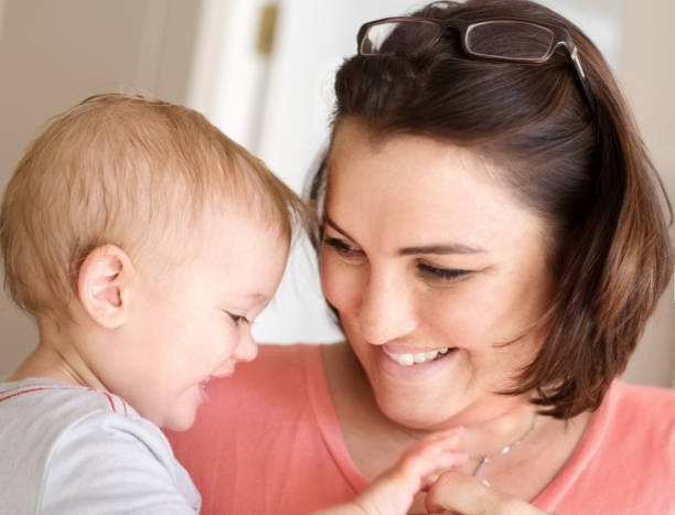 istock Woman playing with her baby boy. 1084708948