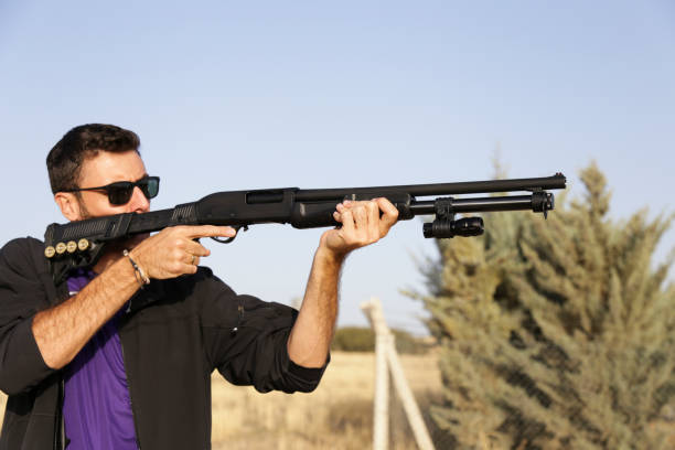 istock Man shooting on an outdoor shooting range, 1084710540