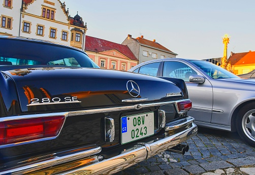 HUSTOPECE, CZECH REPUBLIC - SEPTEMBER 29, 2018: Mercedes Benz logo on a black vintage car. Mercedes-Benz is a German automobile manufacturer. The brand is used for luxury automobiles, buses, coaches and trucks. EU licence plate number.