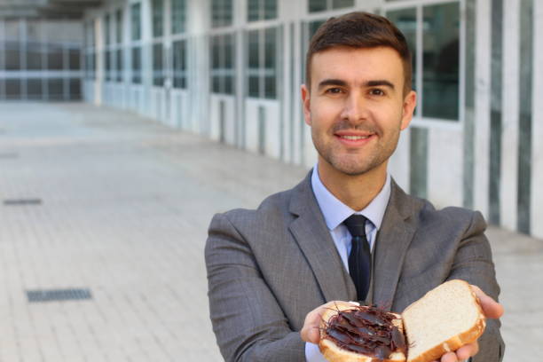 istock Businessman eating a high protein cockroach sandwich 1084728502