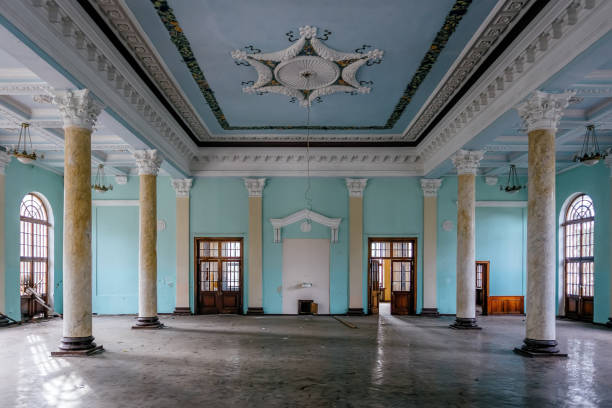 istock Interior of large column hall with fretwork at abandoned mansion 1084730320