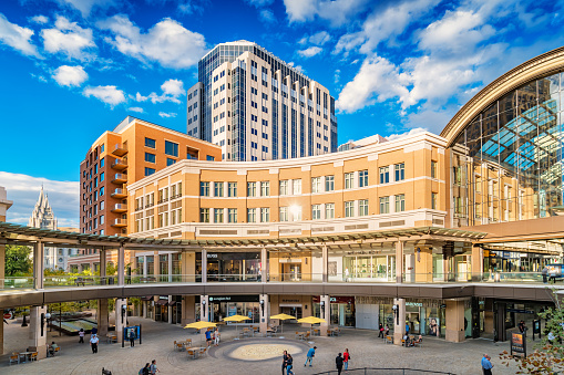 People walk at City Creek Center shopping mall in downtown Salt Lake City, Utah, USA, on a sunny day.