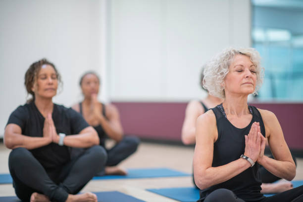 istock Meditating senior women 1084733766