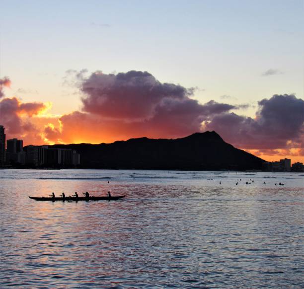 Sunrise over Diamond Head, Waikiki, Oahu Hawaii.  The orange sky makes it looks as though Diamond Head has erupted after being dormant for thousands of years.