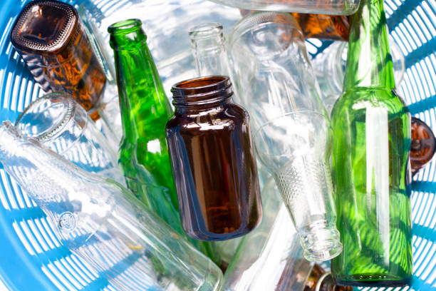 istock Glass bottles in waste basket. 1084741014
