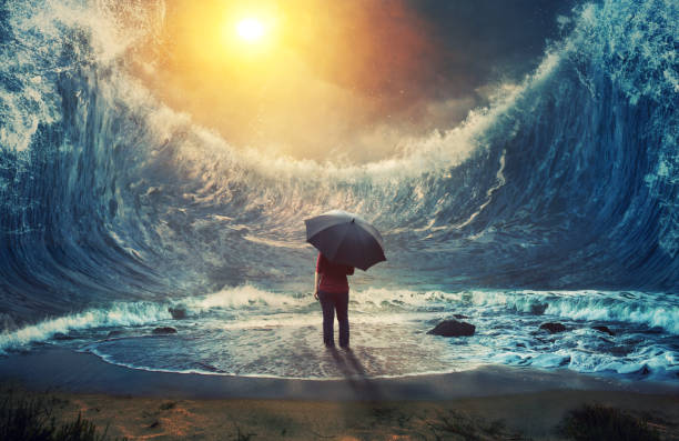 Woman and tidal wave A woman surrounded by large waves and holding an umbrella. tsunami wave stock pictures, royalty-free photos & images