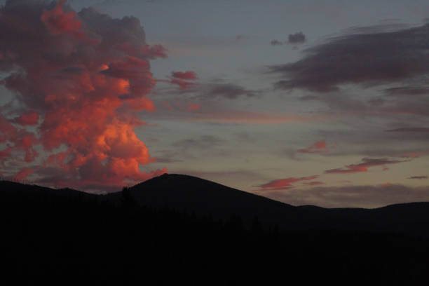 Red clouds at sunset appear as an eruption on Mt. Spokane