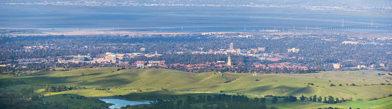 Aerial view of Stanford; Palo Alto, Menlo Park, Redwood City and the San Francisco bay shoreline in the background, Silicon Valley, California
